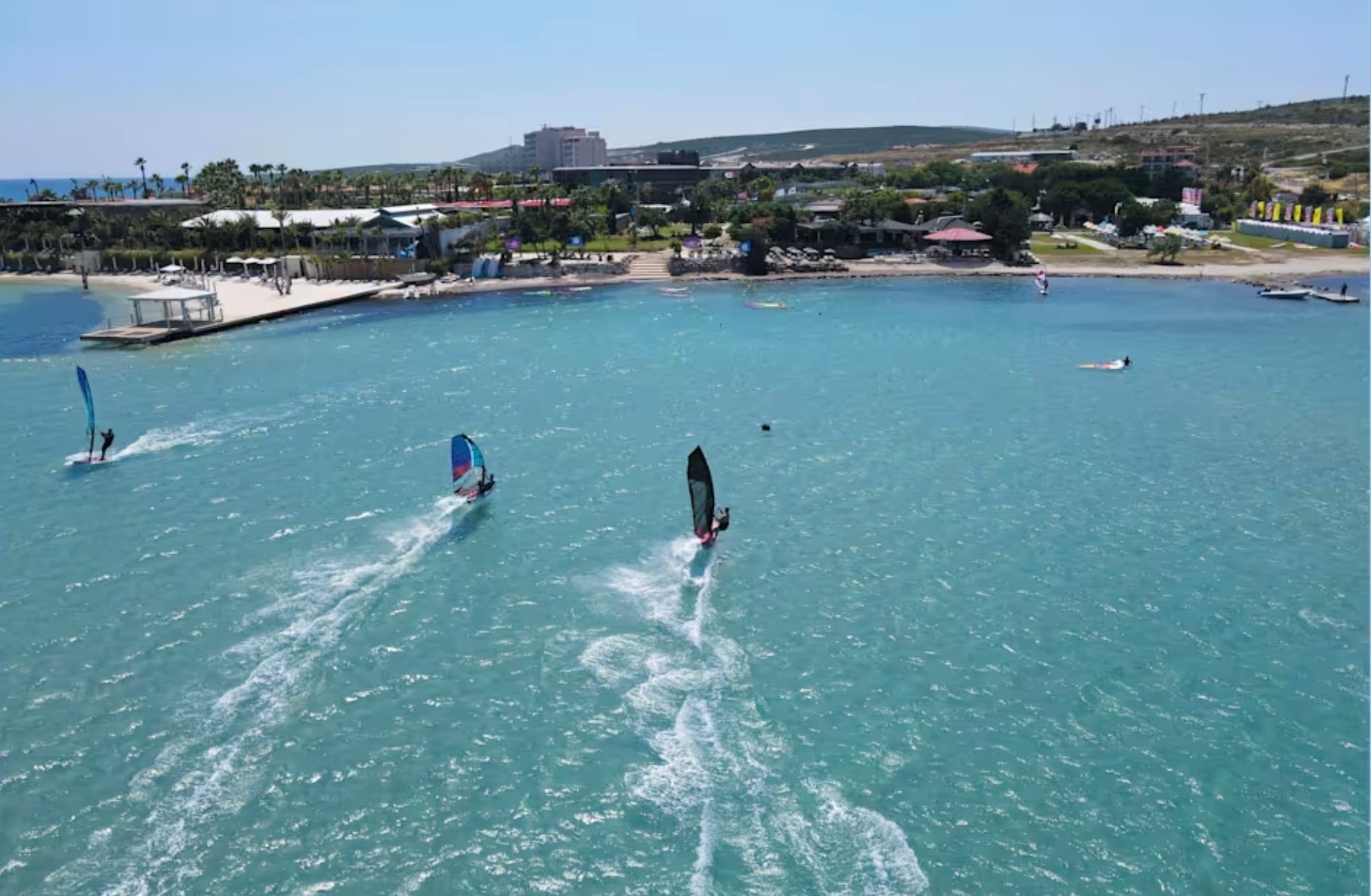 Windsurfers on the shallow flat bay at Alaçatı on Turkey's Aegean coast