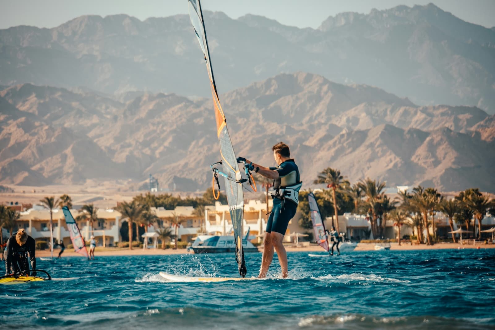 Windsurfers on a flat shallow lagoon at Dahab on Egypt's Red Sea coast