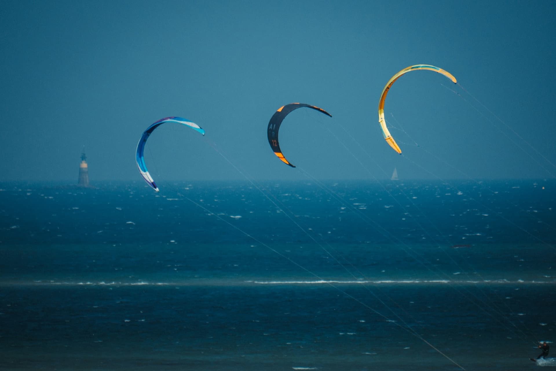 Kites flying over a beach at sunset in the south of France