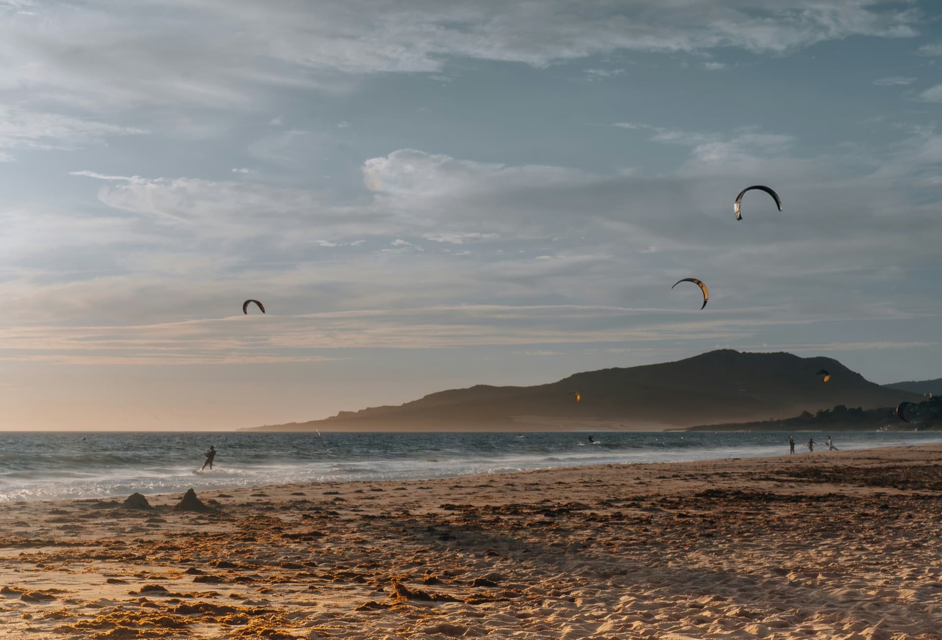 Kitesurfing at sunset on Los Lances, Tarifa's long town beach